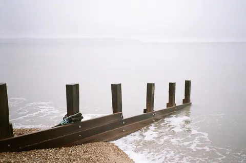 Groyne and sea mist. Milford on Sea, Hampshire, UK